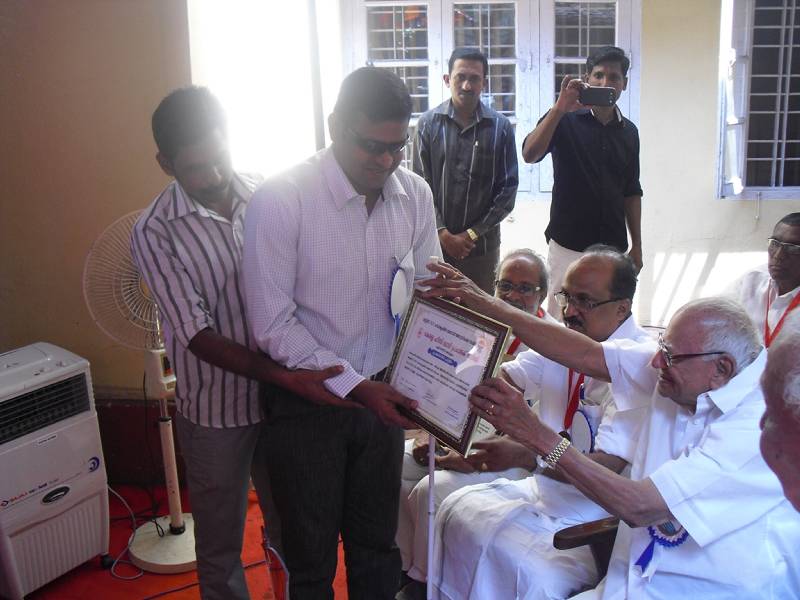 Receiving Award from Justice Krishna Iyer